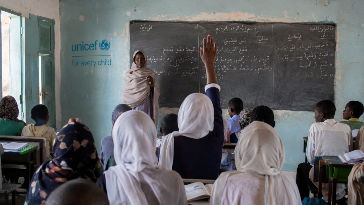 Children attend a reopened classroom as part of efforts to get children out of school in Sudan back into learning
